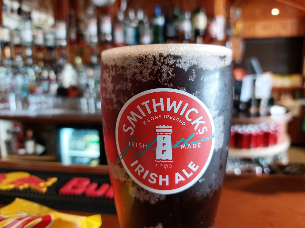 drinking a pint of Smithwicks at McCuaig's on Rathlin Island, Northern Ireland